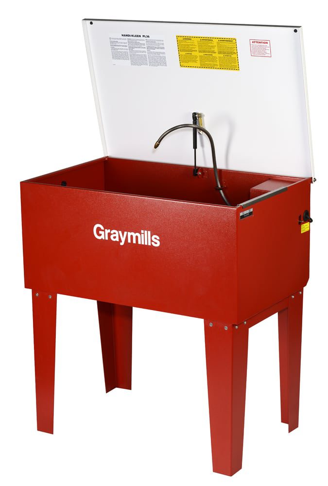 3/4 angle product shot of red waist high industrial washing sink with white lid hinged up and spray nozzle suspended out of sink Product Photography