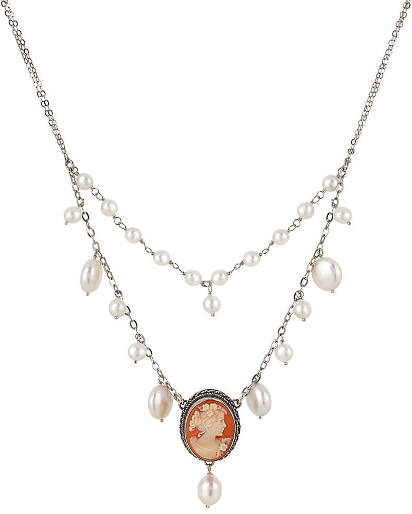 Cameo pendant of girl with flowers in hair on silver chain with pearls all on white background Product Photography