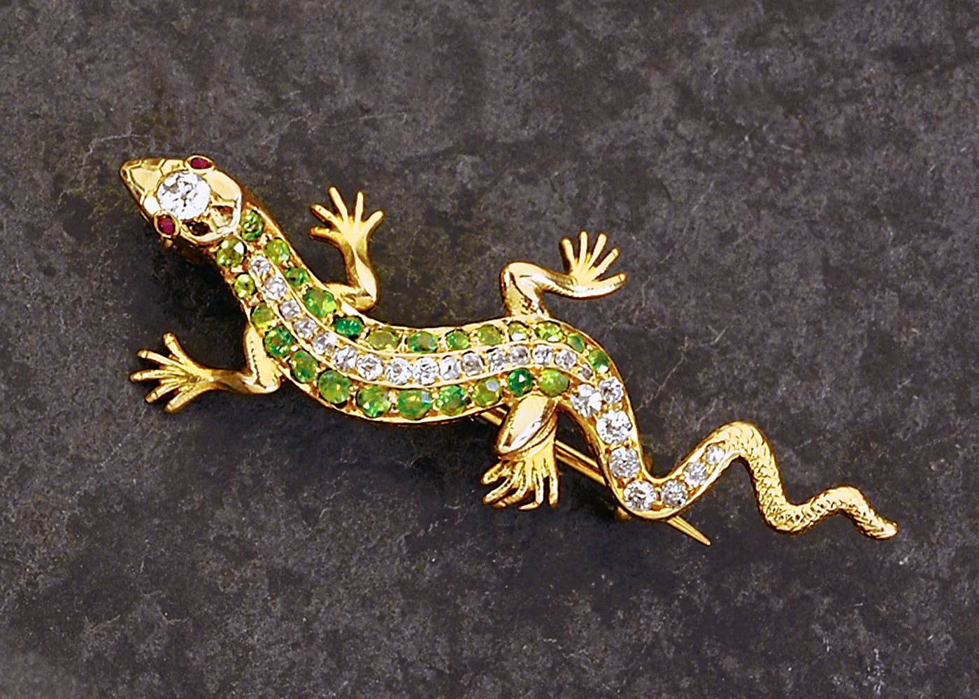 Vintage Geko lizard gold pin with emeralds and diamonds flanking body and ruby eyes and large diamond on head