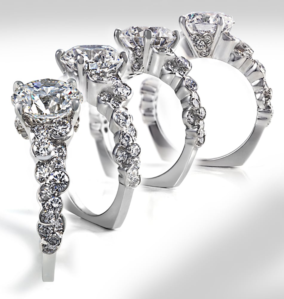 Four views of CumuLLus design diamond platinum ring fanning out to see all angles