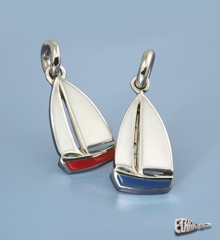 Two enamel sail boat charms sitting up on blue background with "Ethan" charm on bottom Product Photography