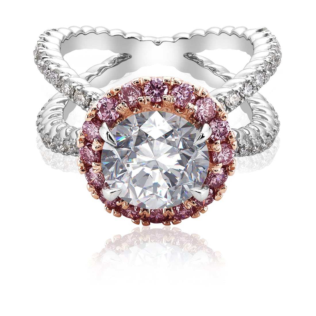 Top angle view of Large round diamond platinum ring with rose gold mounting holding pink diamonds surrounding center stone