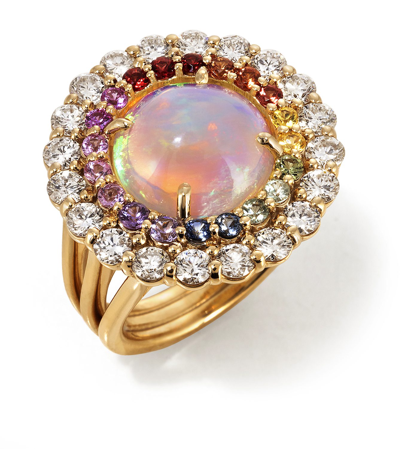 Top view of a three banded gold ring topped with a large reddish opal surrounded by a ring of rainbow colored stones surrounded by a ring of larger diamonds Product Photography