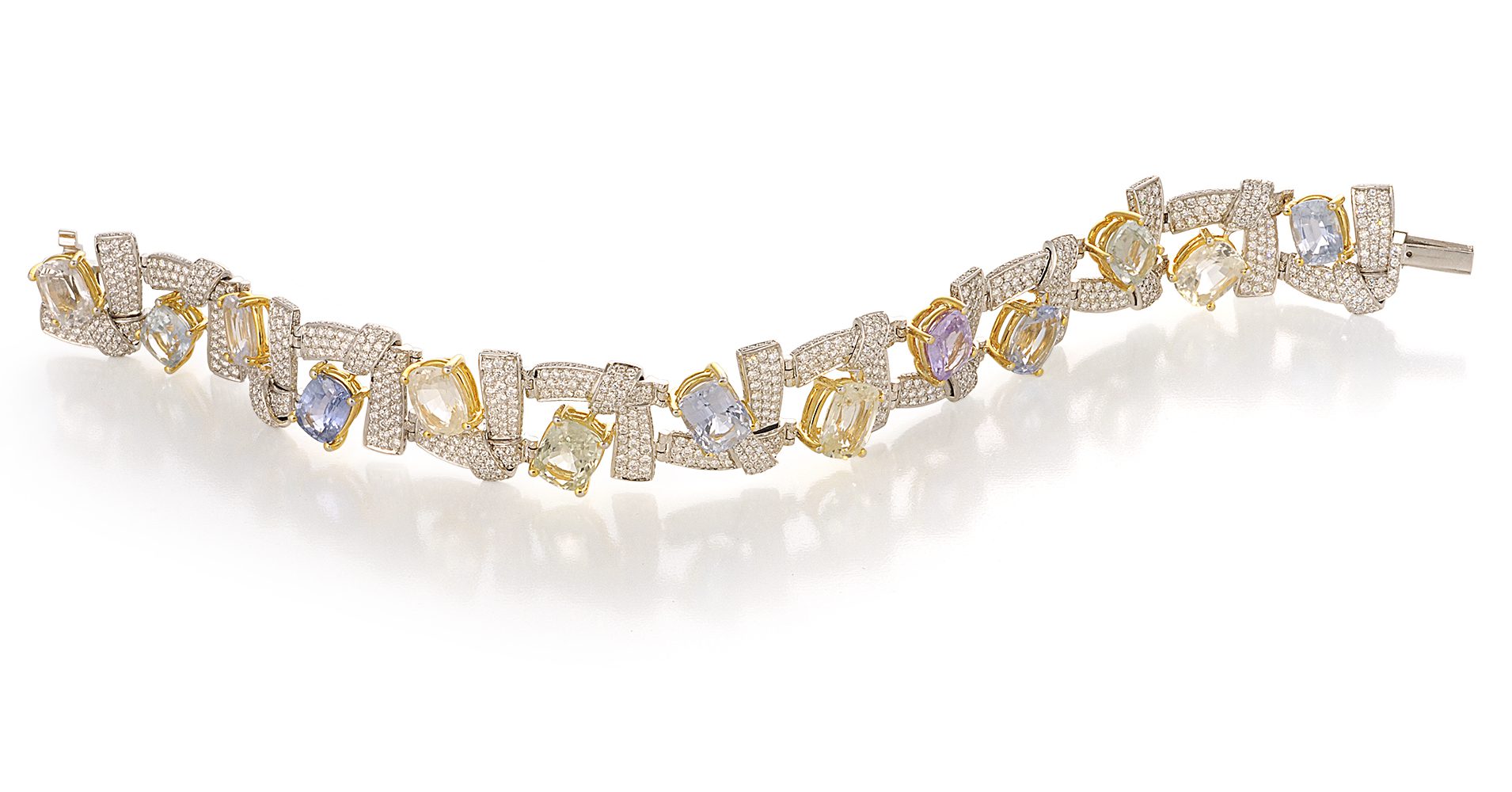 Diamond and fancy stone bracelet on white background