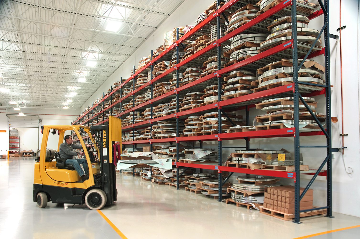 Warehouse showing racks and fork lift